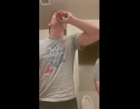 Guy drinks cup of hot sauce