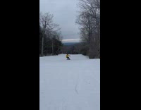Guy yellow jacket snowboard falls down snow