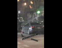 Guy plays bagpipes at night 