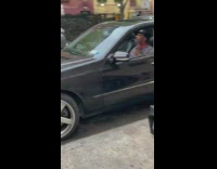 Guy Shaves Face in Car While Playing Loud Music 