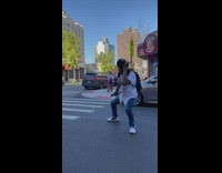 White jersey guy dances street car crosswalk