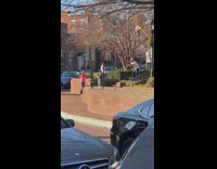 Guy white shirt point to camera stairs