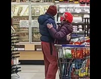 Couple slow dance inside grocery store market 