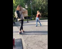 Lady does a spin and catwalks across park 