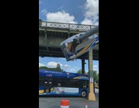 Part of bus roof left on pole 