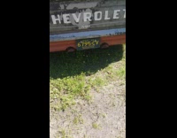 Rusty chevrolet truck parked on grass