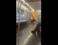 Collab WINY - Man bring large inflatable banana inside the train