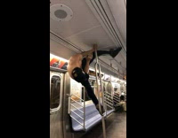 Shirtless guy stands on pole and twerks in the air on subway train