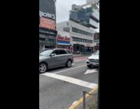 Woman black bag stand middle of traffic