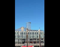 Man sit on top of ship pole