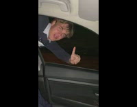 Guy appear beside moving car window like superman 