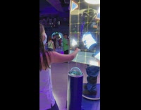 Girl arm over sensor grab virtual shapes