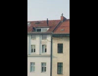 Girl stand balance above building red roof