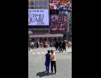 Ladies film dance video at Times Square