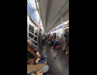 Fishbowl camera, subway performer breakdances  red boombox