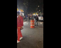 Man as traffic barrel scaring people 
