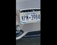 License plate tied to car to prevent theft