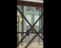 Black dress barefoot girl poses blue building 