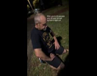 Drunk old dad kneel on grass night
