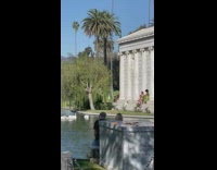 Three women in dress poses behind the funeral home