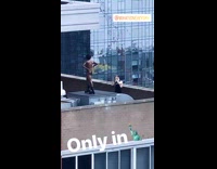 Guy rooftop photoshoot wearing only socks shoes 