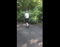 Guy carries turtle park ranger follows scolds