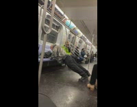 Guy works out on subway 