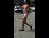 NSFW Guy in only pink boxers walking around to YMCA song
