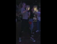 IITW - woman grey shirt dancing night time