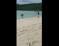 Girl enjoys filming dance at the beach