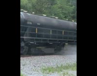 Railway maintenance train grind tracks spray water