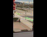 Girl has photoshoot red ball sculpture