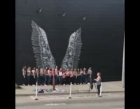 Large group pose with wings art