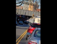Tall bus destroyed under the overpass bridge