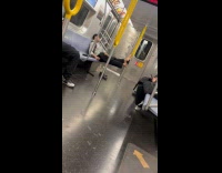 Man ride train rest bare feet on pole
