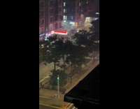 Man pull lit belt firecrackers street night