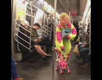 Donald trump in neon pink green suit pushes baby doll stroller in subway train