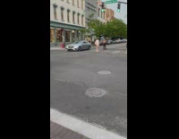 Woman pose middle of street during green light
