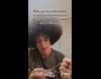 Guy huge afro hair eating ice cream with spoon 