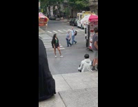 Woman green jacket pose on street NYC
