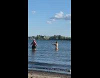 Girl green bikini selfie stick fix hair