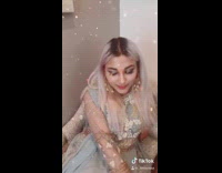 Pink pajamas girl sits down blue dress 