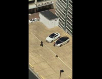 Woman releases money near the luxury cars on the rooftop