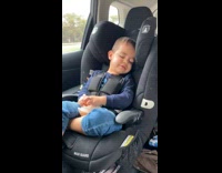 Little boy eat fries with eyes closed