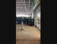 Car crashed into store hits through wall