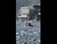 Woman red bikini handstand pole baby mother