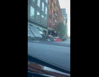 Man in Joker costume laughs for filmer