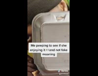 Colorful sweater guy peeks out styrofoam container 