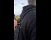 Construction wall guy yells people on street