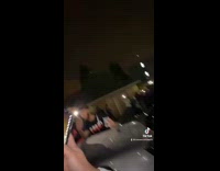 People crowd around guy on car record  